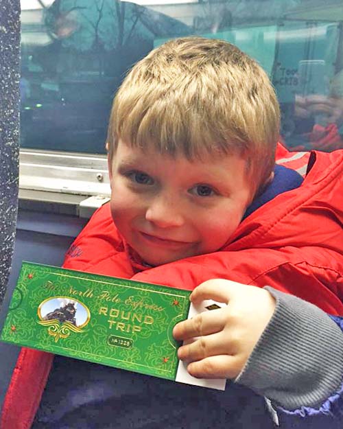 Hudson displays his Polar Express Ticket
